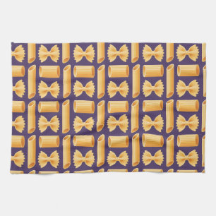 Array of various pasta shapes on a purple kitchen towel