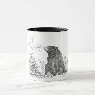 Arrêtez et sentez la tasse de fleurs