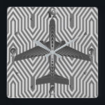 Art Deco Airplane, Graphite and Silver Grey Square Wall Clock<br><div class="desc">Clock as an Art Deco inspired concept of a futuristic plane,  in a striped,  silky gradient of silver to deep graphite grey / grey,  against  a light and deep silver grey,  Deco background</div>