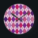 Art Deco Argyle  Round Clock<br><div class="desc">This wall clock has an art deco design of diamond shapes made from overlapping angles in black lines colored in shades of purple and pink with diagonal black lines making the design look like argyle</div>