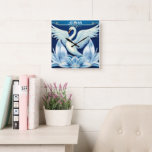 Art Deco Swan and Lilies Throw Pillow Square Wall Clock<br><div class="desc">A white swan spreads its wings over art deco lilies on a beautiful blue background.</div>