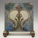 Art Nouveau Elegance Jade Bronze Tile<br><div class="desc">Experience the allure of the Art Nouveau movement with this enchanting ceramic tile that artfully fuses jade green and bronze hues. It boasts an elegant, symmetrical design reminiscent of natural forms and structures, a signature of the period. The graceful lines and curves are highlighted in a burnished bronze tone, contouring...</div>