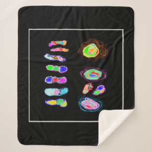 Art puffs and fluffs on a black backdrop sherpa blanket