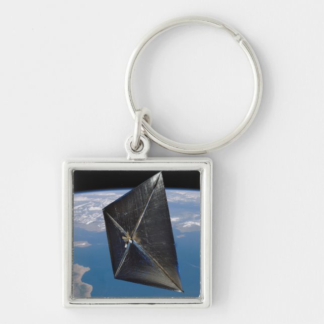 Artist concept of NanoSail-D in space Keychain (Front)