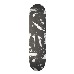 Artistic black white brush strokes splatters paint skateboard