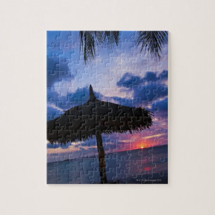 Aruba, silhouette of palapa on beach at sunset 2 jigsaw puzzle