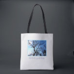 As the tree spirit sleeps tote bag<br><div class="desc">This As the tree spirit sleeps Tote Bag features the branches of a twisted old tree silhouetted against a chilly blue sky, and says "As the tree spirit sleeps... " The light textured background adds to the seasonal mood. Offered in Medium (shown) and Large, the bag is perfect for your...</div>