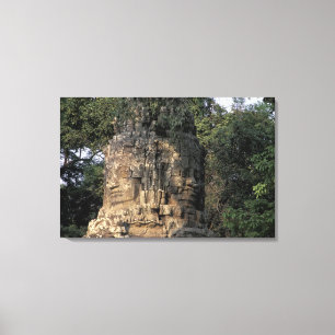Asia, Cambodia, Siem Reap. Huge stone sculptures Canvas Print