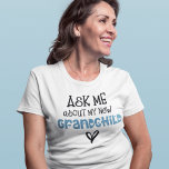 Ask Me About My New Grandchild Blue Faux Glitter  T-Shirt<br><div class="desc">Ask Me About My New Grandchild Blue Faux Glitter. Humour for the new grandmother to wear,  an artsy typographical design with fun quote,  in a mix of black and blue faux glitter typography and heart motifs.</div>