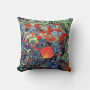 Aspen leaf on a lichen covered rock throw pillow