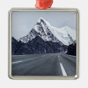 Asphalt Road in front of Snow Mountain Metal Ornament
