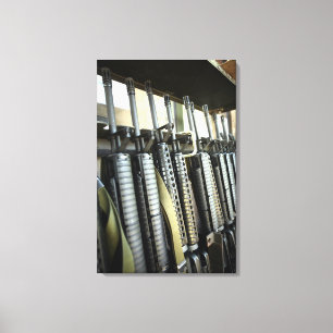 Assault rifles stand ready on the weapons rack canvas print