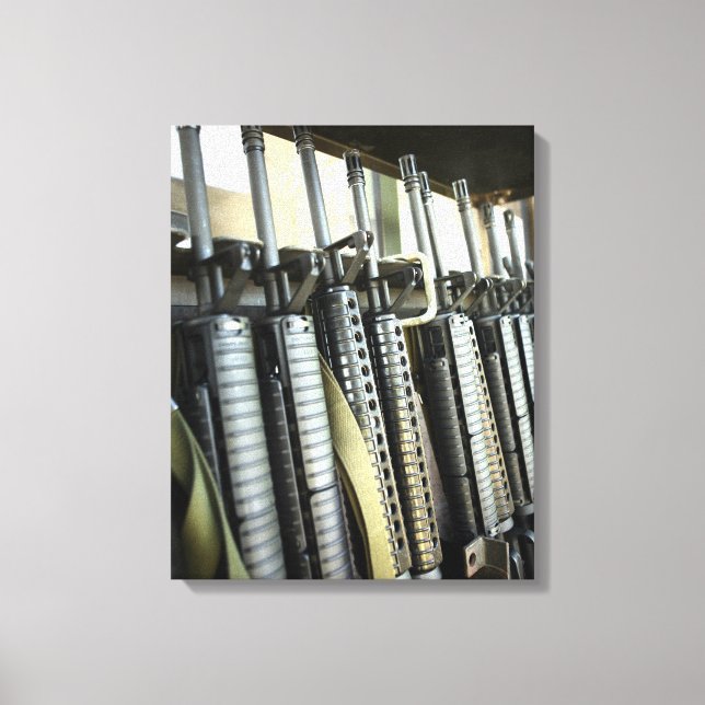 Assault rifles stand ready on the weapons rack canvas print (Front)