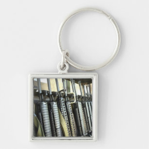 Assault rifles stand ready on the weapons rack keychain