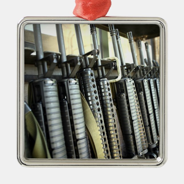 Assault rifles stand ready on the weapons rack metal ornament (Front)