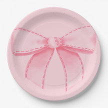 Assiette en papier avec ruban rose et fond rose un