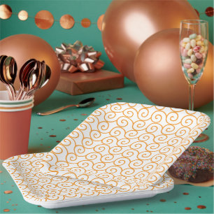 Assiettes En Carton Un tapis marron et orange avec un motif répétitif