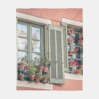 ASSORTED-COLOR FLOWERS IN VASE NEAR WINDOW FLEECE BLANKET