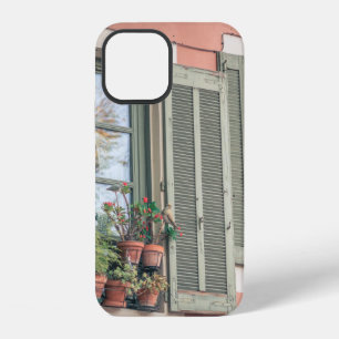 ASSORTED-COLOR FLOWERS IN VASE NEAR WINDOW iPhone 12 CASE