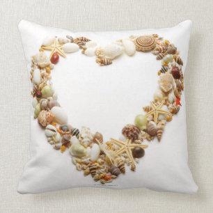 Assorted seashells form heart shape throw pillow