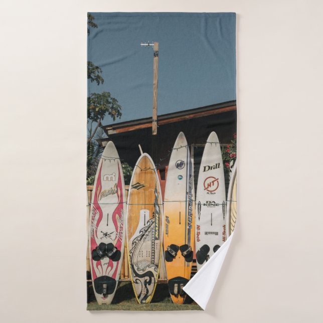 Assorted surfing boards stands on open field in th bath towel (Bath Towel)