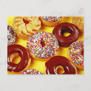 Assortment of fresh tasty doughnuts postcard