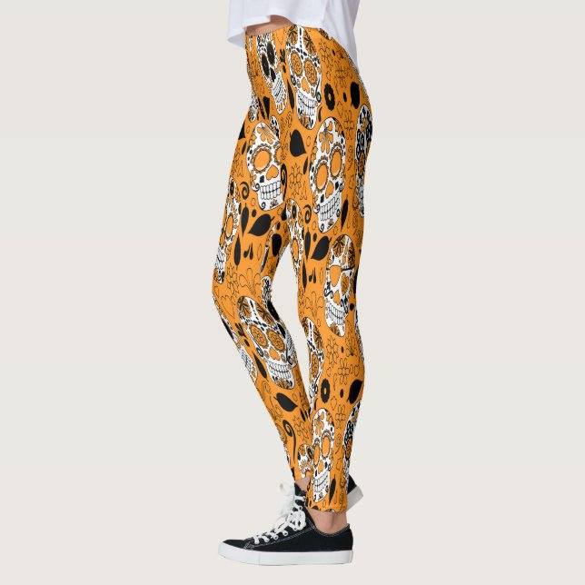 Assortment of orange and white sugar skull leggings (Left)