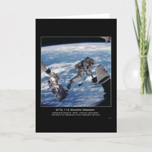 Astronaut David A. Wolf  transfers the Starboard O Card