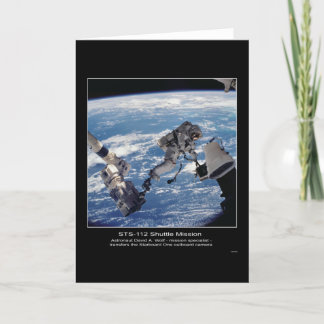 Astronaut David A. Wolf  transfers the Starboard O Card
