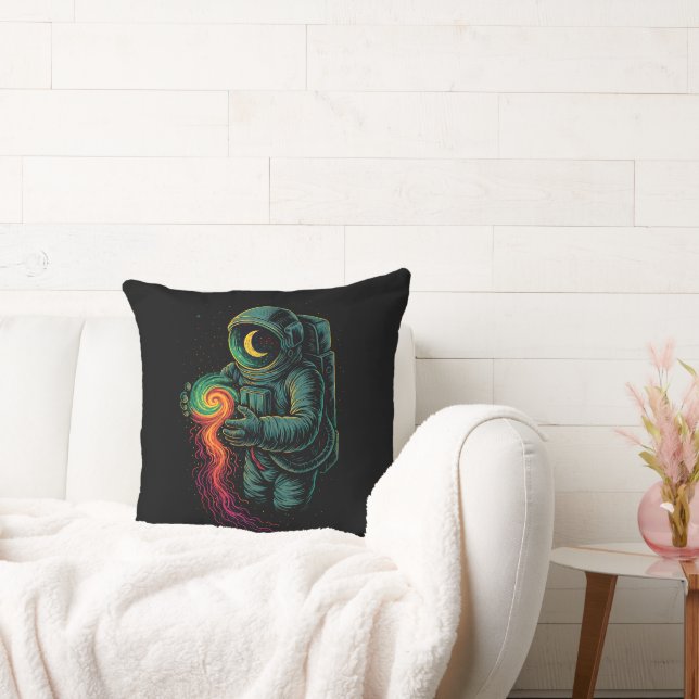 Astronaut Holding a Cosmic Spiral Throw Pillow (Couch)