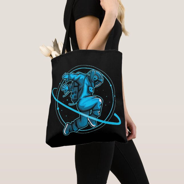 Astronaut Jumping Dancing Around Saturn Artwork | Tote Bag (Close Up)
