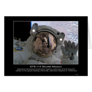 Astronaut Soichi Noguchi waves at astronaut Stephe