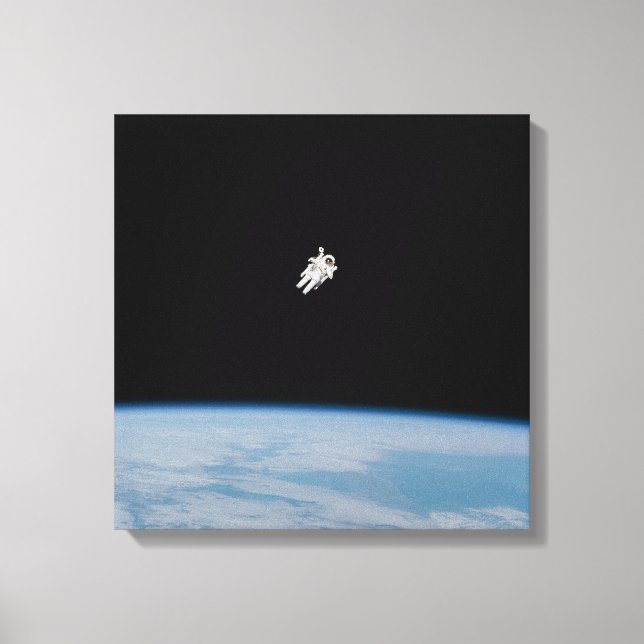 Astronaut Spacewalking Above Earth Canvas Print (Front)