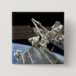 Astronauts perform a series of tasks 2 inch square button