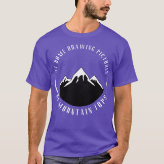At home drawing pictures of mountain tops