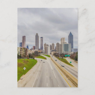 Atlanta skyline over highway postcard