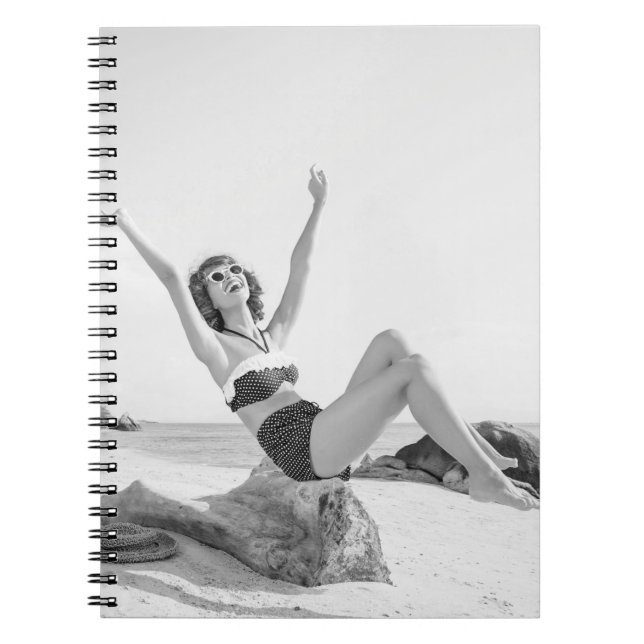 Attractive young woman in bikini on the beachvinta notebook (Front)