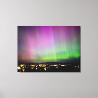 Aurora Borealis over City Lights Canvas Print