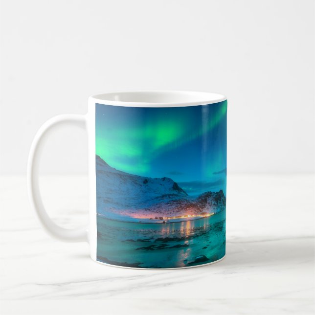 Aurora borealis over the sea coast, snowy mountain coffee mug (Left)