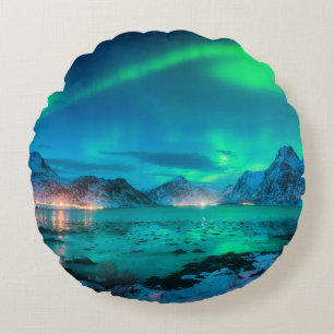 Aurora borealis over the sea coast, snowy mountain round pillow