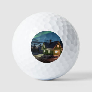 Aurora borealis over winter cabin golf balls