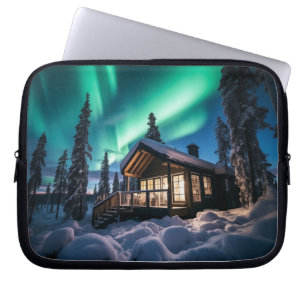 Aurora borealis over winter cabin laptop sleeve