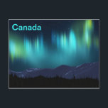 Aurora Borealis Postcard<br><div class="desc">A multi-coloured, fractal rendering of the aurora borealis, or Northern Lights, superimposed on a digital painting of snow-covered mountains. Text reading "Canada" also appears. The aurora borealis (or Northern Lights), named after the Roman goddess of dawn, Aurora, and the Greek name for the north wind, Boreas. Many cultural groups have...</div>