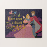 Aurora & Phillip Once Upon a Dream Waltz Jigsaw Puzzle<br><div class="desc">Step into a fairytale with this enchanting “Once Upon a Dream” design starring Princess Aurora and Prince Phillip in their magical ballroom moment. Surrounded by blooming roses, dreamy clouds, and the three good fairies—Flora, Fauna, and Merryweather—this romantic graphic brings timeless Disney elegance to life. Perfect for customizable gifts, apparel, and...</div>