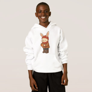 Autocollant de lapin d'hiver confortable buvant du