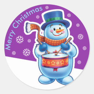 Autocollant rond violet de Noël Snowman batteur.