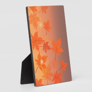 Autumn design with maple leaves and bokeh effect plaque