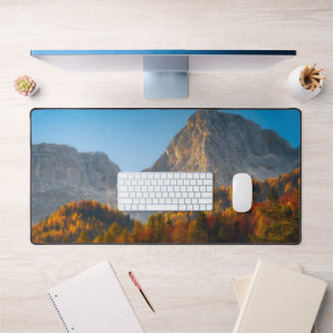 Autumn forest below mountains desk mat