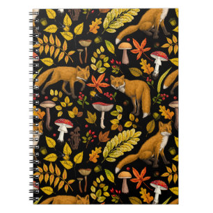 Autumn foxes on black notebook