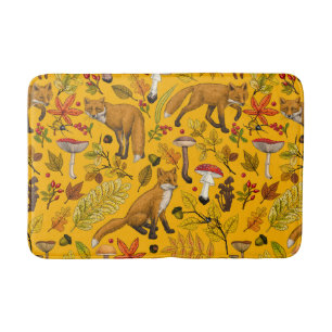 Autumn foxes on orange bath mat